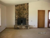 Stone fireplace, large windows and lots of room 16