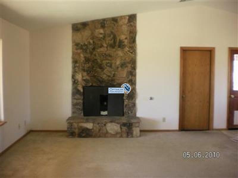 Stone fireplace, large windows and lots of room 5