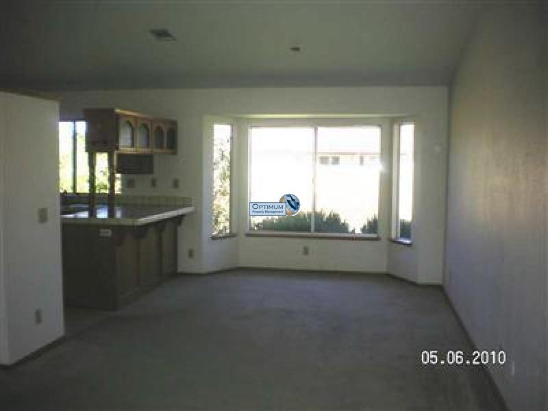 Stone fireplace, large windows and lots of room 4